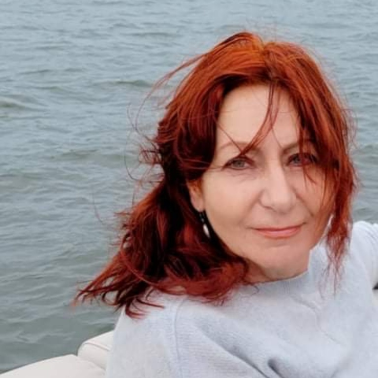 red haired woman on a boat