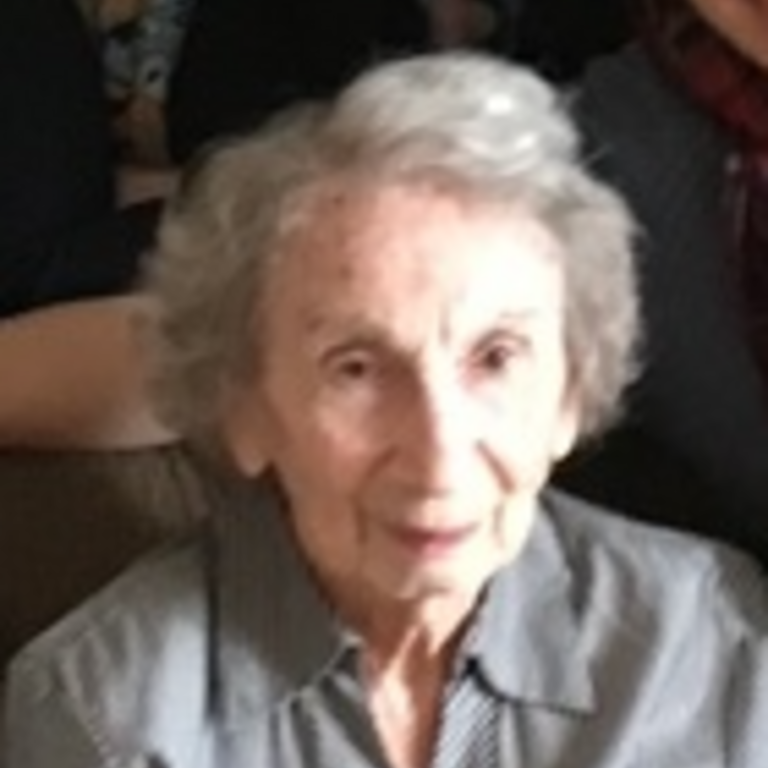 woman with grey hair in a grey shirt