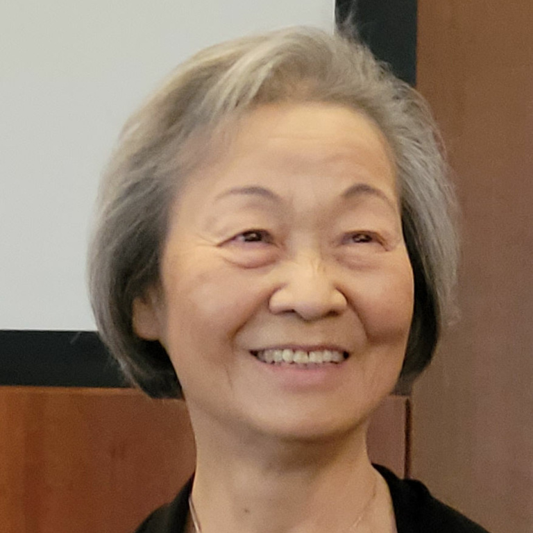 woman with grey hair smiling