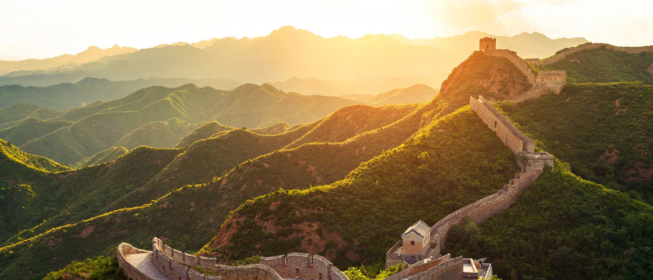 The sun setting over the Great Wall of China.