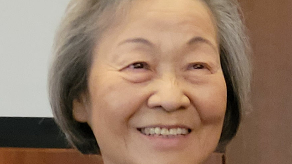 woman with grey hair smiling