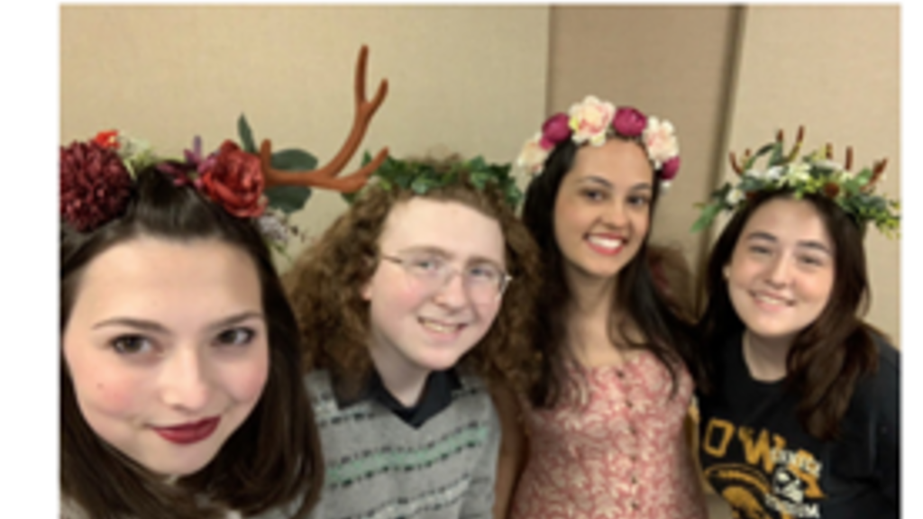 four students pose for a picture at the Russian event: Kapustnik