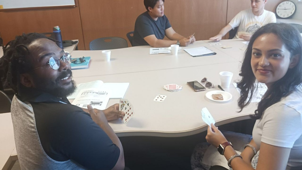 Students sit around conference room table for Russian Conversation Hour